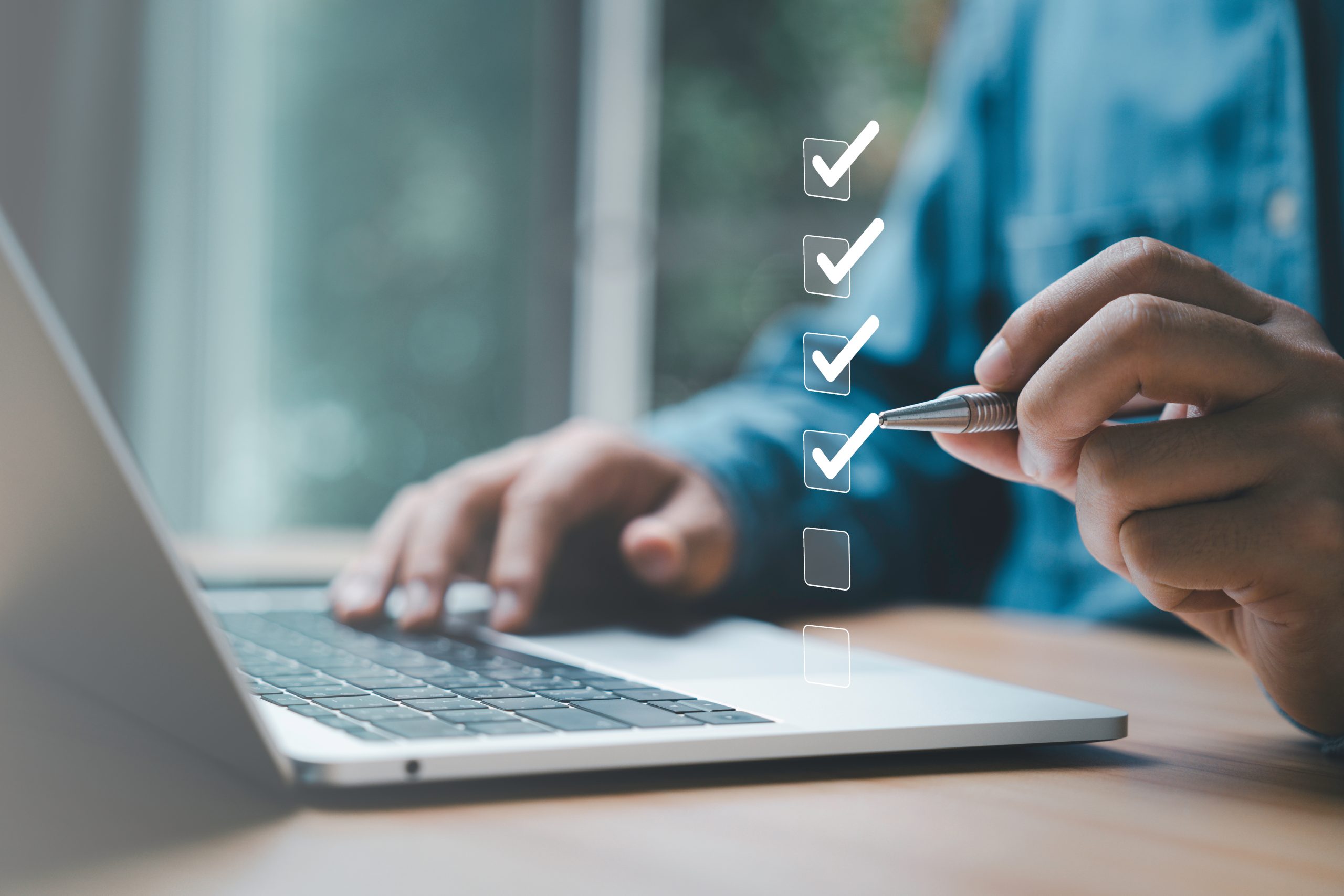 Businessman use pen to tick correct sign mark in checkbox for qu Businessman use pen to tick correct sign mark in checkbox for qu