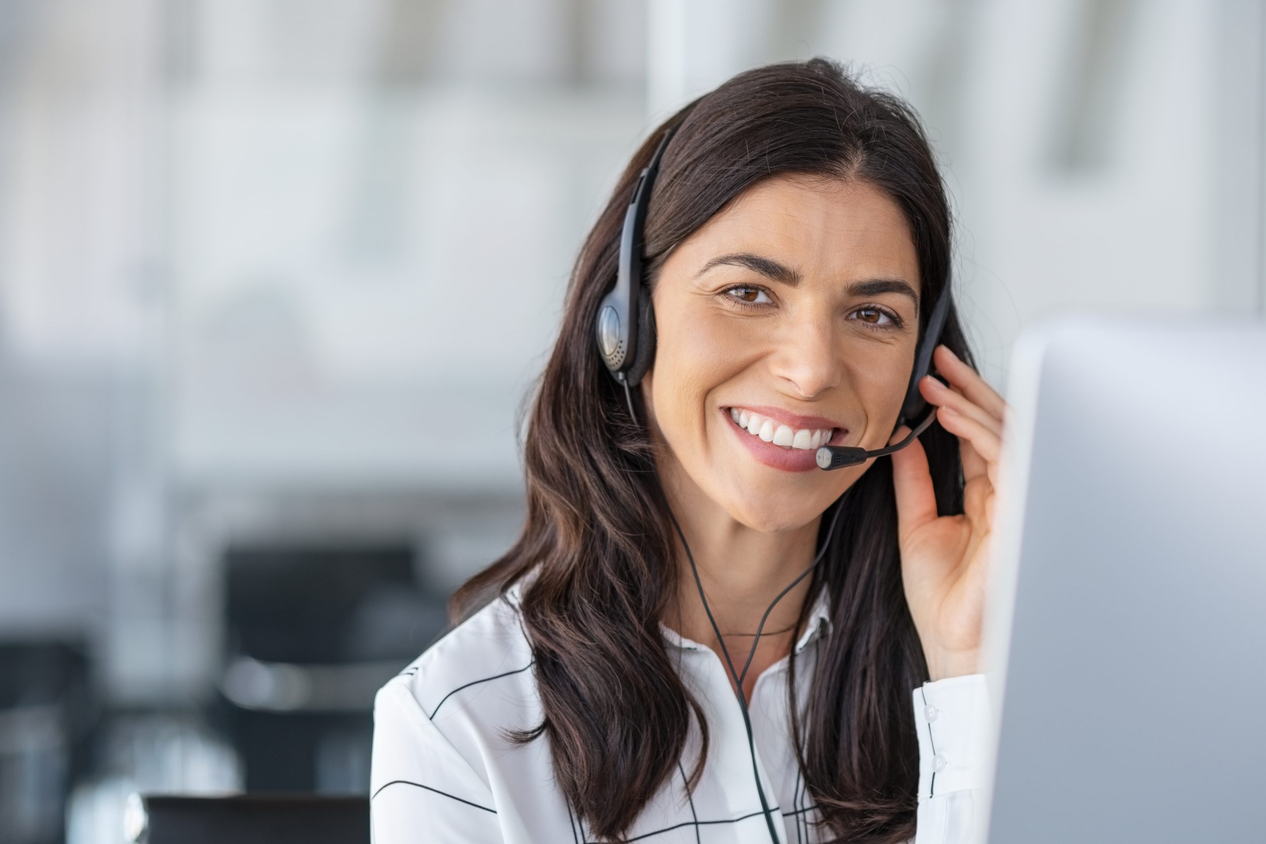 Happy smiling woman working in call center Happy smiling woman working in call center